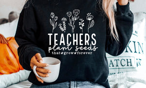 Teachers plant seeds (TEE ONLY)